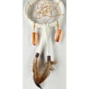 A white dream catcher with quartz crystals and feathers.