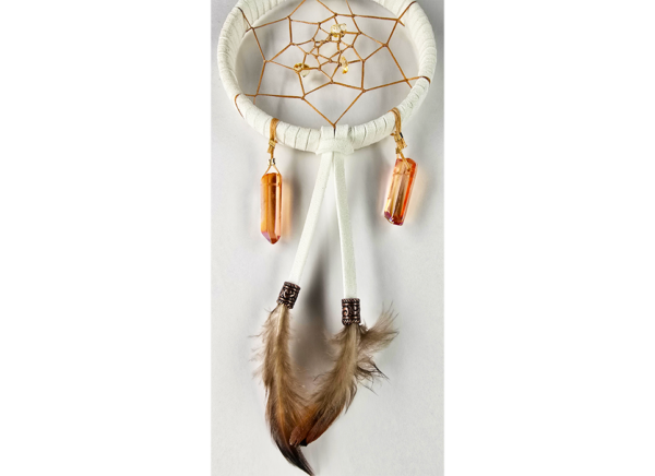 A white dream catcher with quartz crystals and feathers.