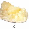 A large stilbite mineral specimen with mounds of crystal structures.