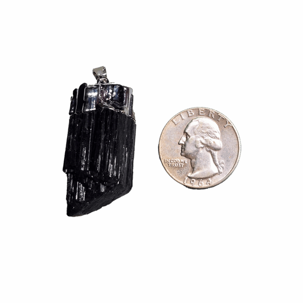 Black Tourmaline silver plated cap and bail pendant with a quarter for size comparison. It is larger than the quarter.