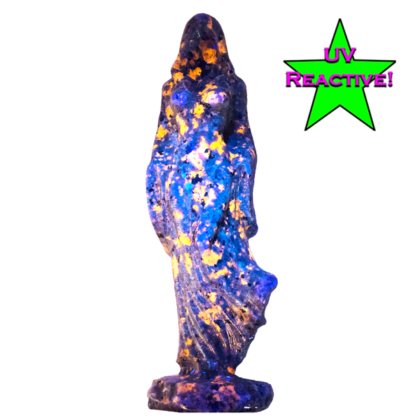 20260908_175857 Yooperlite Lady Death carving measuring 7.25 inches tall with dark coloring and orange UV-reactive orange spotting
