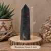 ff28fa72-1b29-4543-ac99-1a077c4d26b5 Bloodstone crystal tower measuring 5 inches tall with dark green coloring, red inclusions, and natural variations